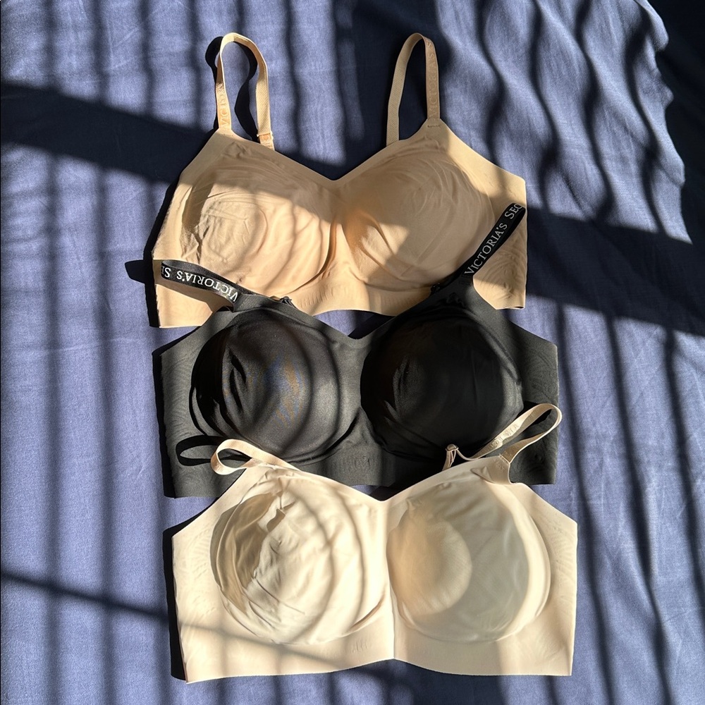 3 Victoria's Secret Lightly lined Bra’s in three colors. Black, Nude and taupe.